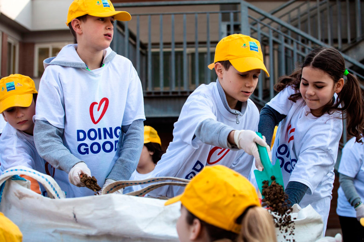 Children beautify a local park in Rome, Italy (Good Deeds Day)