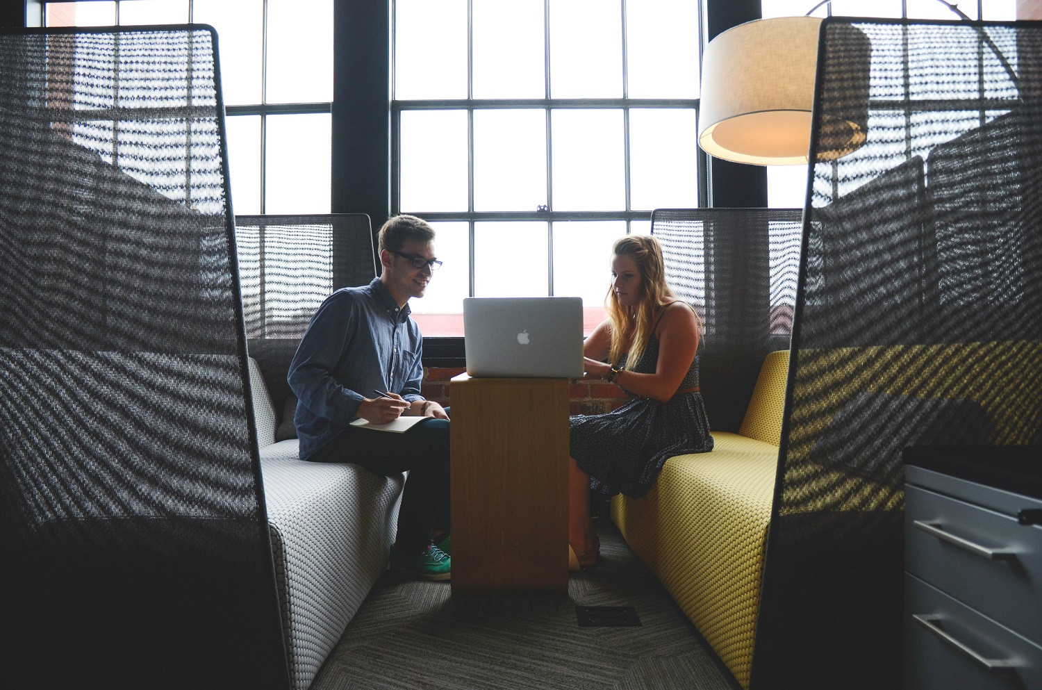 Employees taking advantage of a comfortable office space.