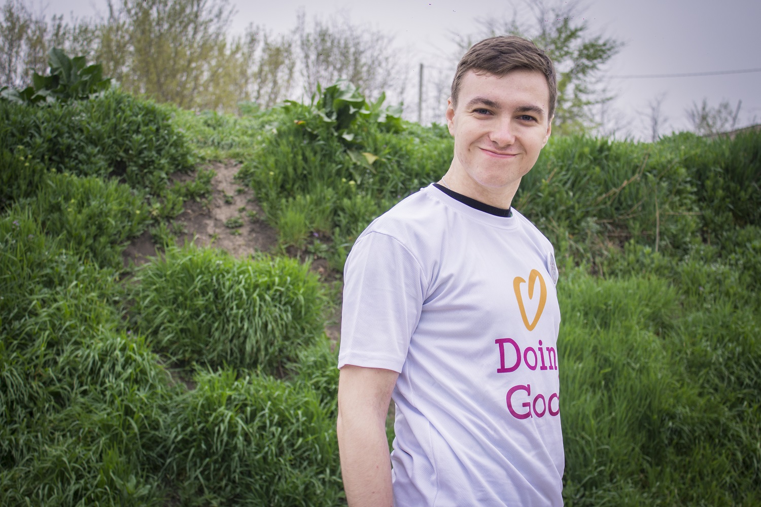 A volunteer from Moldova smiles while doing good.