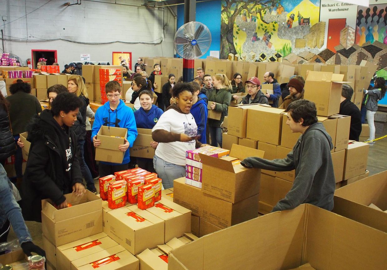 Volunteers for the Jewish Relief Agency package goods to be distributed to those in need.
