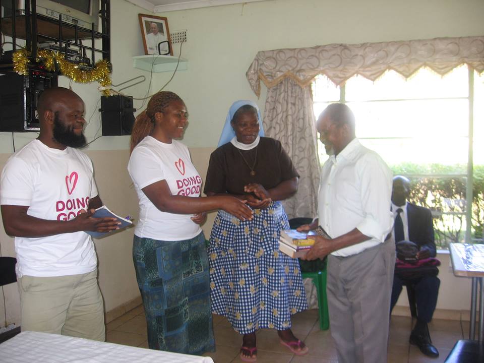 Volunteers from Rebuild Sakubva celebrating their love of books on Good Deeds Day 2017